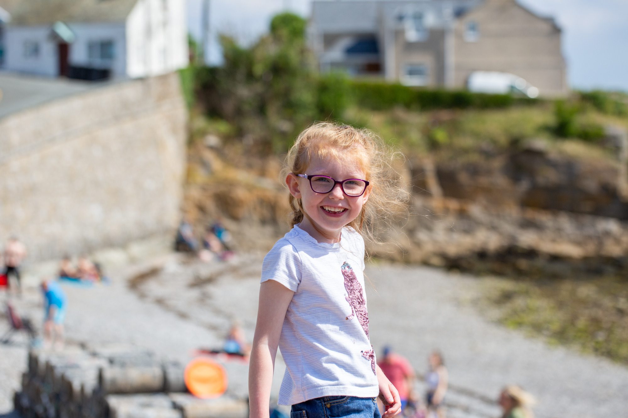 young girl smiling at the seaside