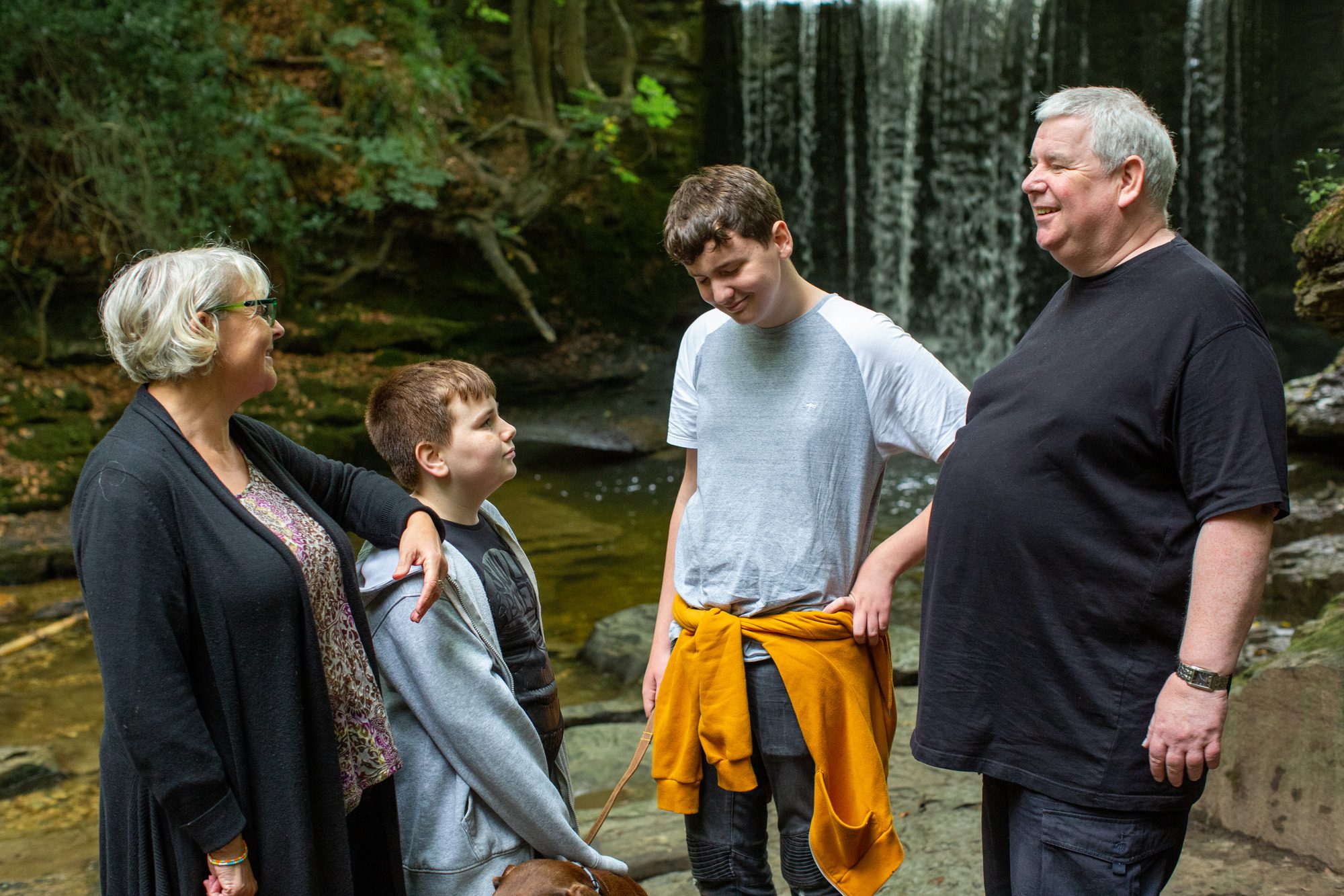 family photo near a waterfall