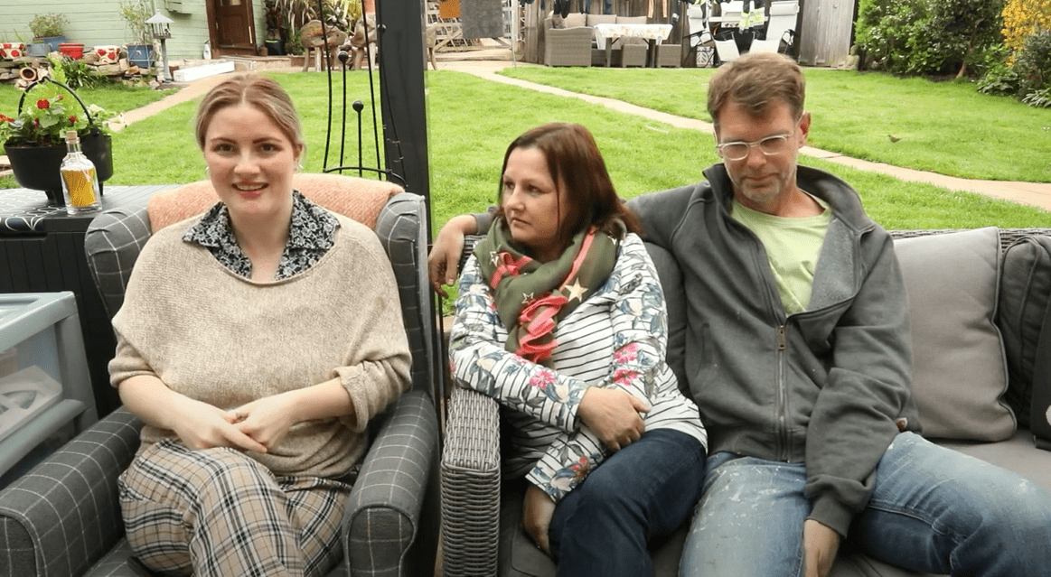 family having a photo in their back garden