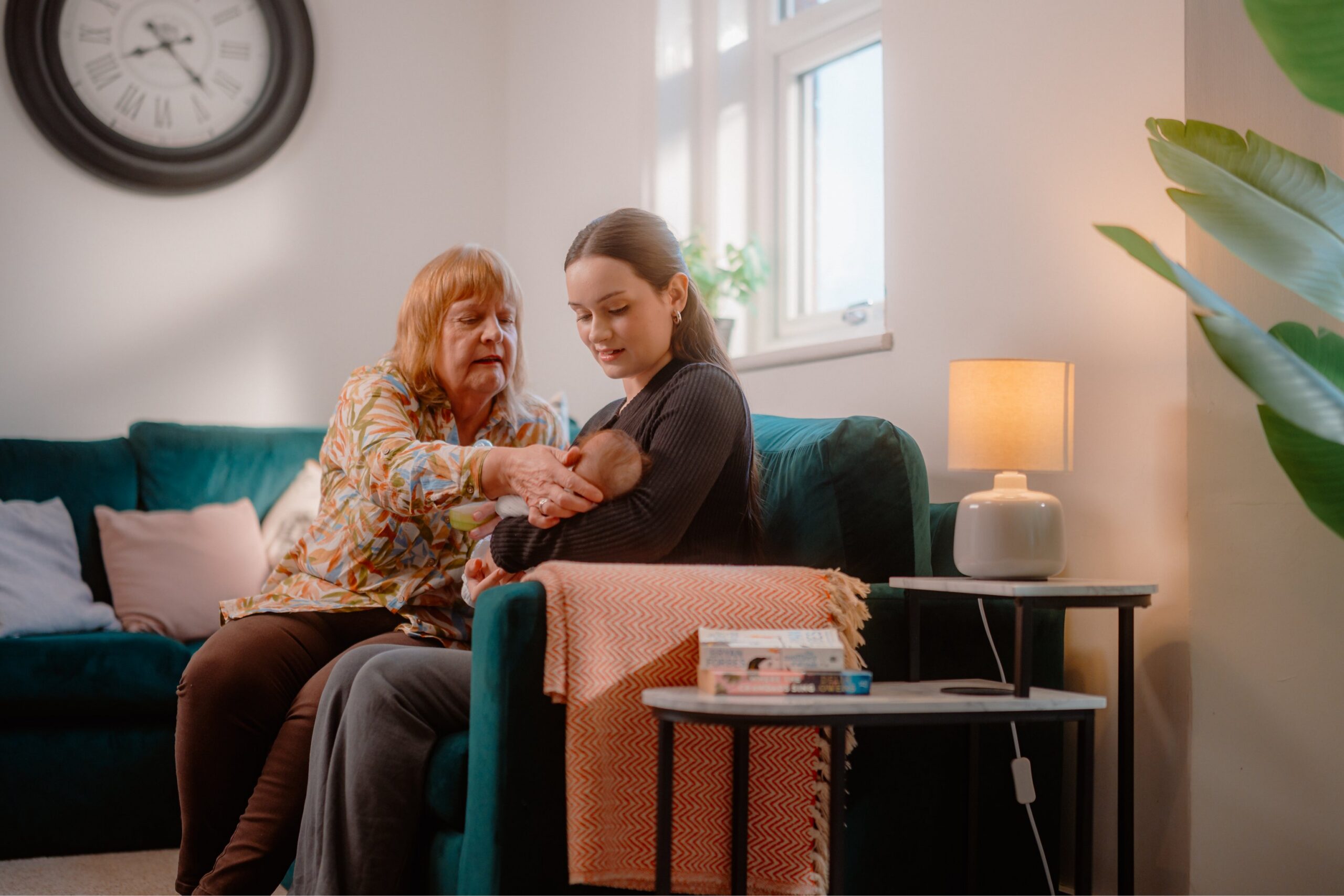 A female foster carer with a parent and child